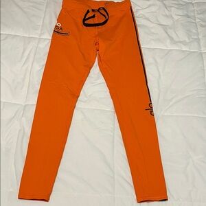 ALO Yoga Vibrant Orange Leggings with Black Accents